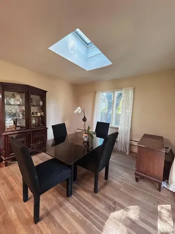 a living room with furniture rug and window