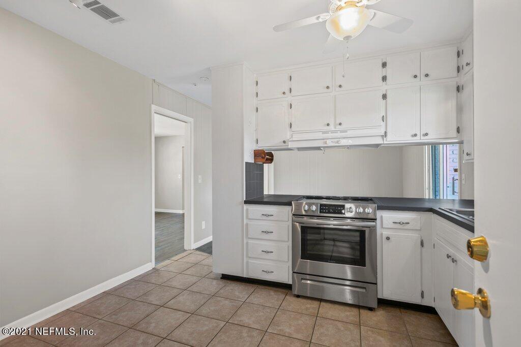 5115 Brighton Drive Jacksonville, FL 32217 - Photo 14 of 37 a kitchen with cabinets appliances and a sink