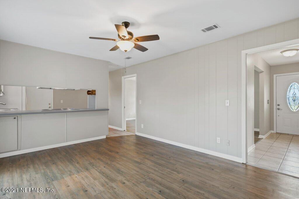 5115 Brighton Drive Jacksonville, FL 32217 - Photo 18 of 37 a view of kitchen with wooden floor and window