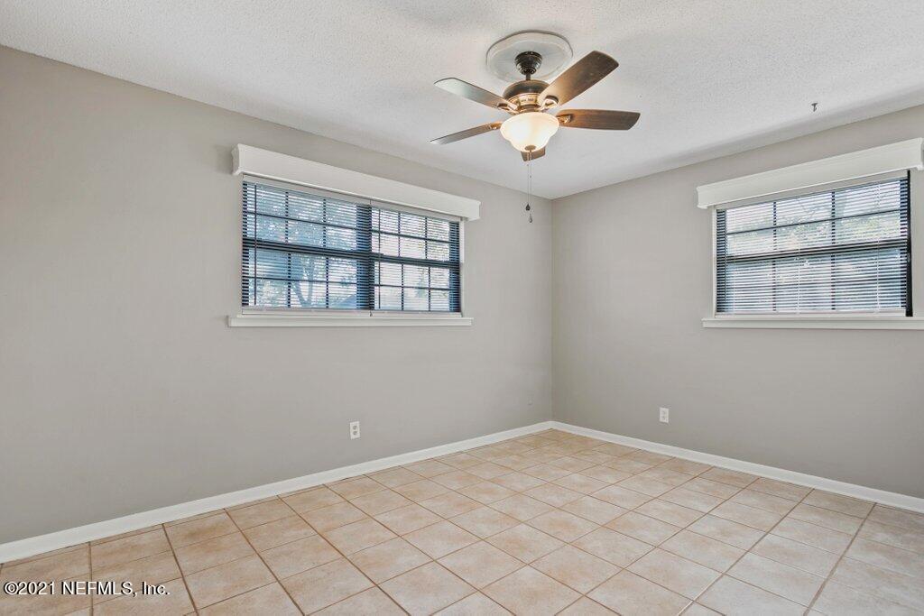 5115 Brighton Drive Jacksonville, FL 32217 - Photo 19 of 37 an empty room with windows