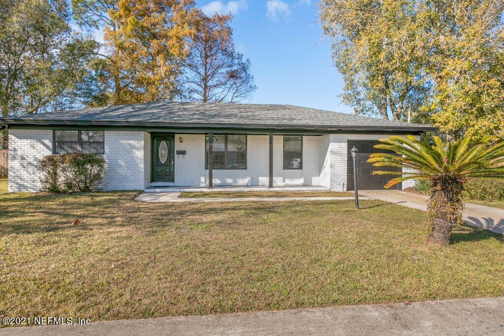 5115 Brighton Drive Jacksonville, FL 32217 - Photo 2 of 37 a front view of a house with a yard