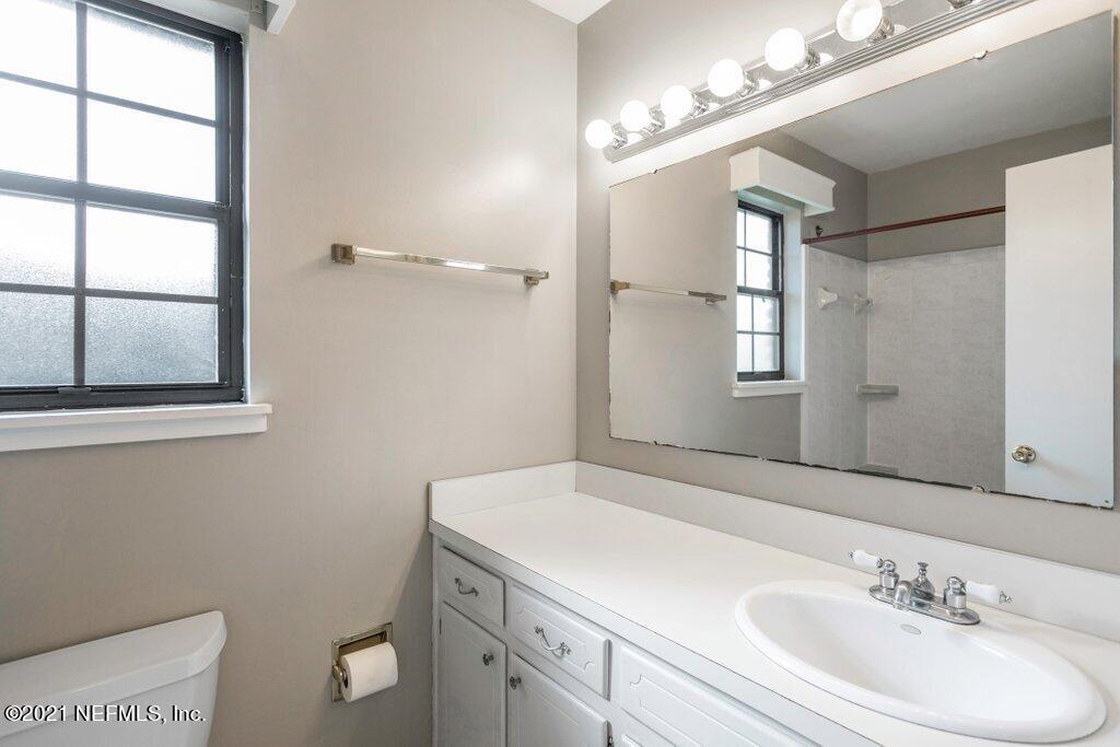 5115 Brighton Drive Jacksonville, FL 32217 - Photo 21 of 37 a bathroom with a sink a toilet and shower