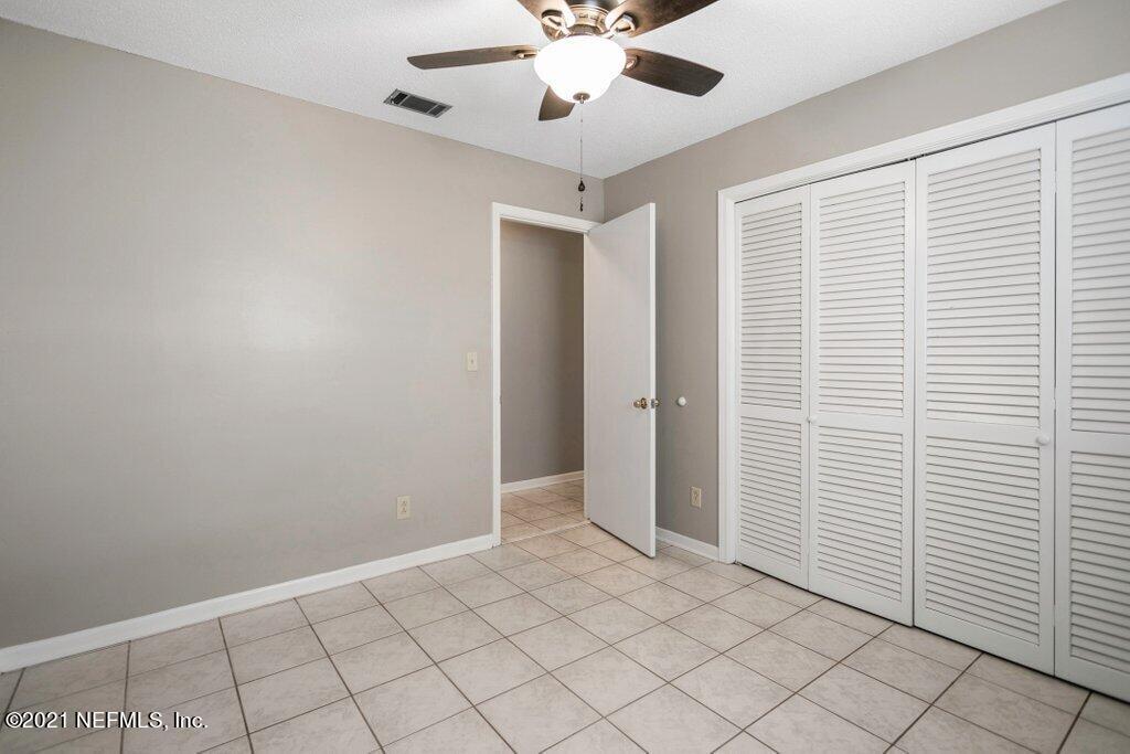 5115 Brighton Drive Jacksonville, FL 32217 - Photo 23 of 37 wooden floor in an empty room and a window