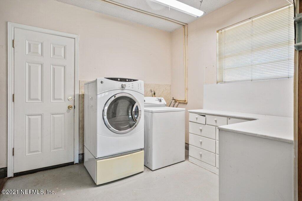 5115 Brighton Drive Jacksonville, FL 32217 - Photo 30 of 37 a utility room with dryer and washer
