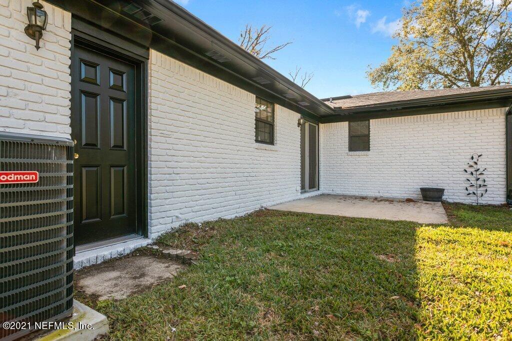 5115 Brighton Drive Jacksonville, FL 32217 - Photo 33 of 37 a view of backyard with a large tree