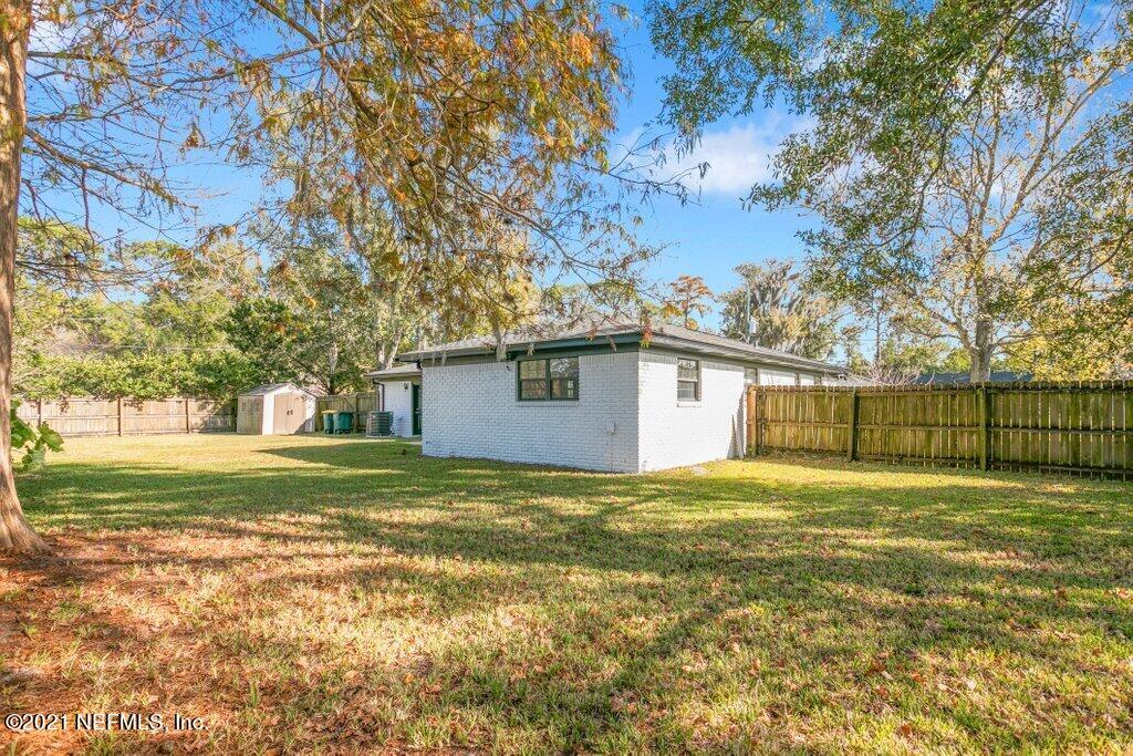 5115 Brighton Drive Jacksonville, FL 32217 - Photo 36 of 37 a view of a yard in front of a house with a large tree