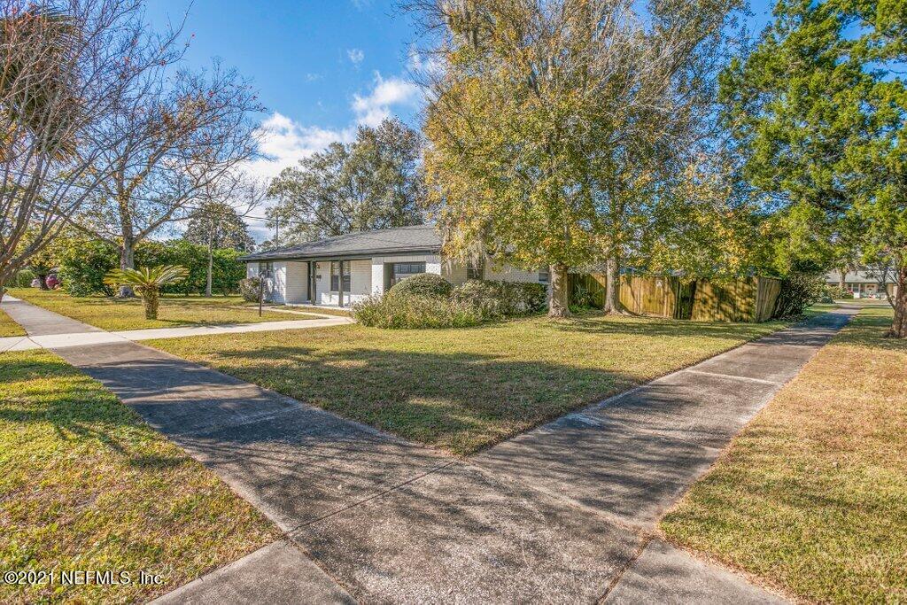 5115 Brighton Drive Jacksonville, FL 32217 - Photo 4 of 37 a front view of a house with a yard