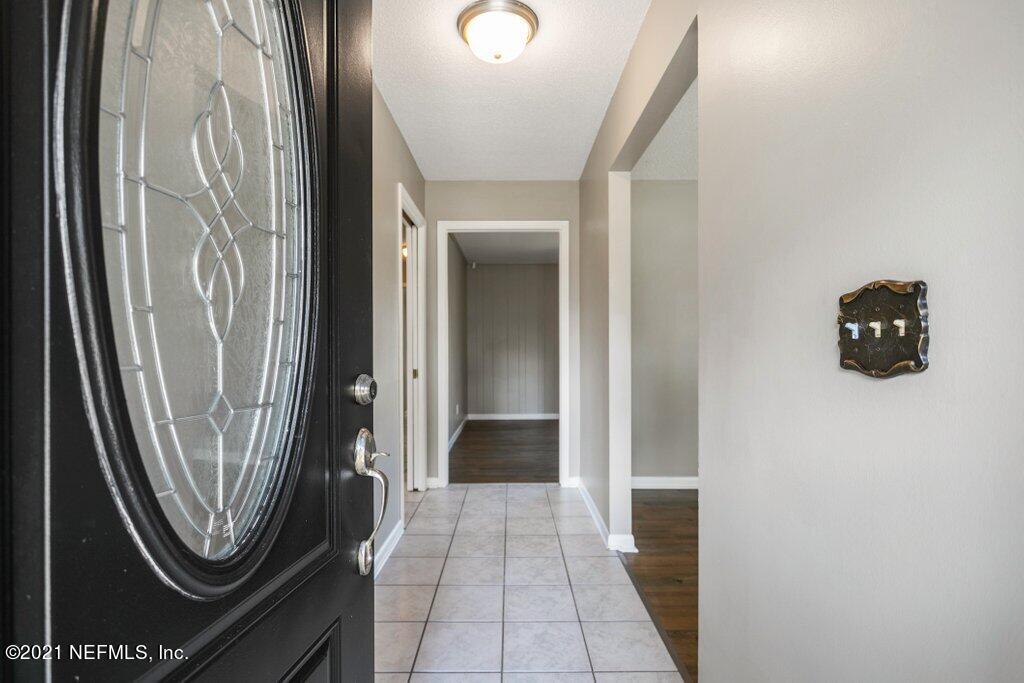 5115 Brighton Drive Jacksonville, FL 32217 - Photo 6 of 37 a view of a hallway with washer and dryer