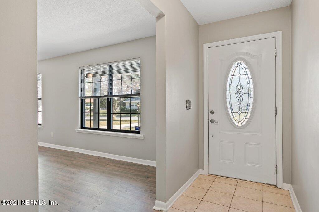 5115 Brighton Drive Jacksonville, FL 32217 - Photo 7 of 37 a view of an entryway with wooden floor