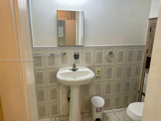 6471 Southwest 27th Street, Unit 2 Miramar, FL 33023 - Photo 11 of 15 a bathroom with a sink toilet and a mirror