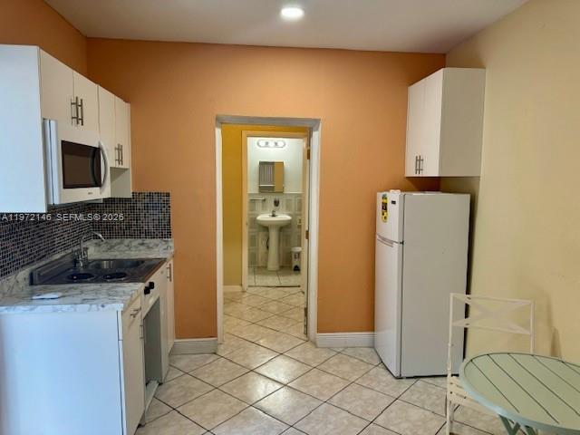 6471 Southwest 27th Street, Unit 2 Miramar, FL 33023 - Photo 6 of 15 a kitchen with a refrigerator and a sink