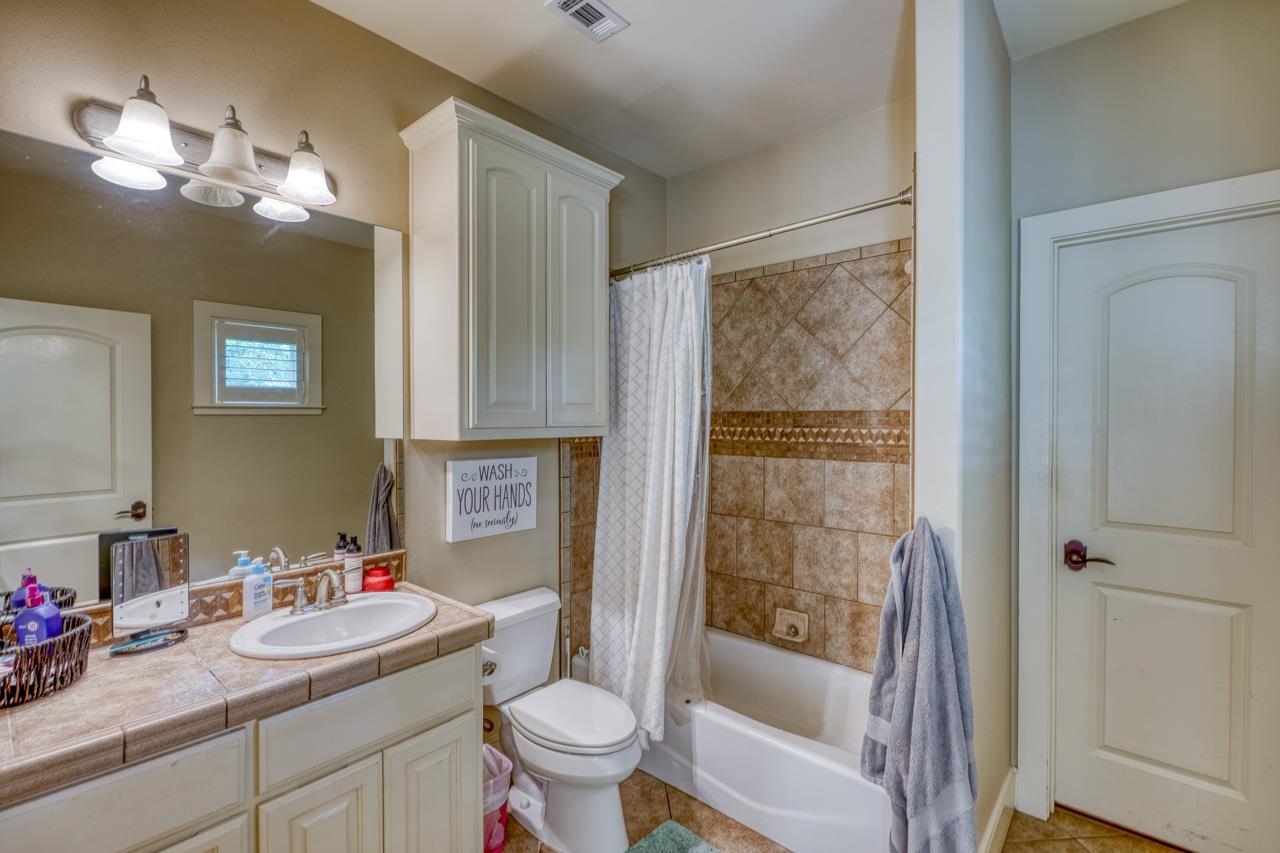 791 Ranch Road 2323 Llano, TX 78643 - Photo 13 of 30 a bathroom with a sink a toilet and shower