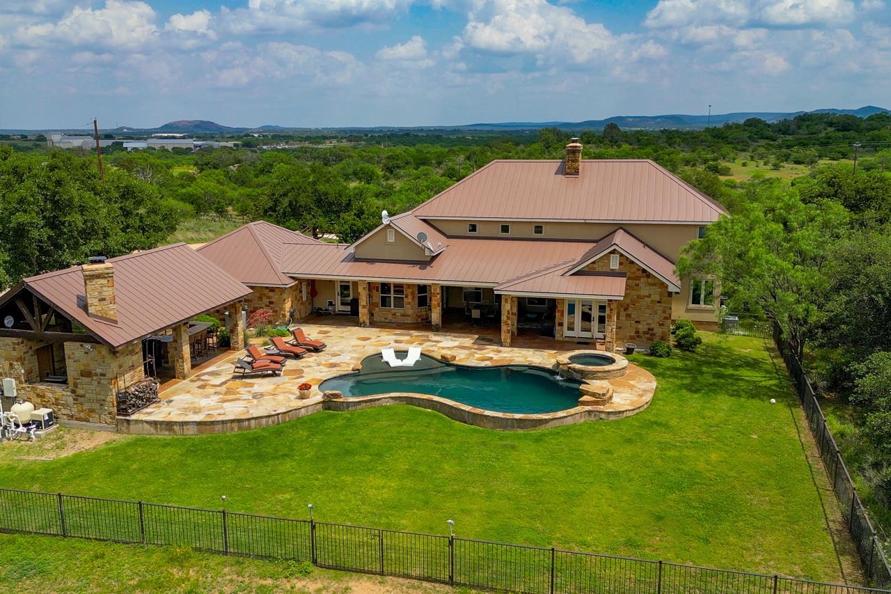 791 Ranch Road 2323 Llano, TX 78643 - Photo 23 of 30 a aerial view of a house with swimming pool garden and patio