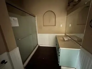 a bathroom with a sink and a mirror