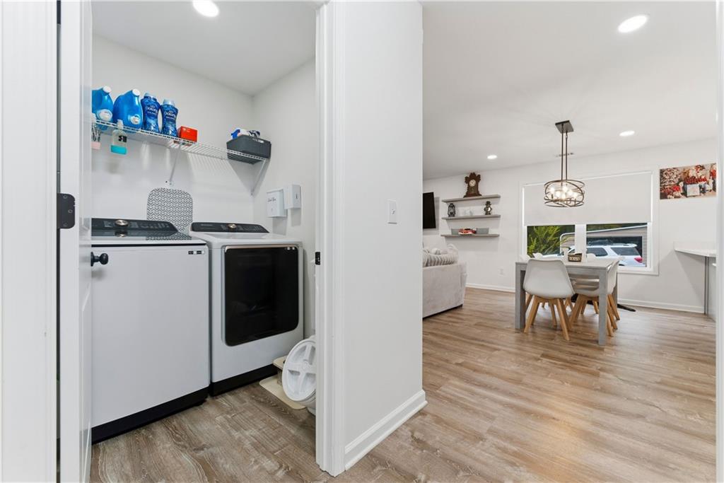62 Dude Street Northwest Rome, GA 30165 - Photo 15 of 22 a kitchen with a refrigerator and a dining table