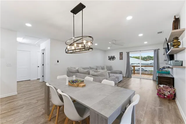 a very nice looking dining room with a table and chairs