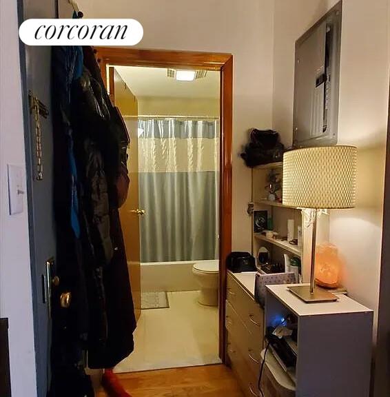 342 53rd Street, Unit 3F Brooklyn, NY 11220 - Photo 4 of 5 a room with a refrigerator and a table