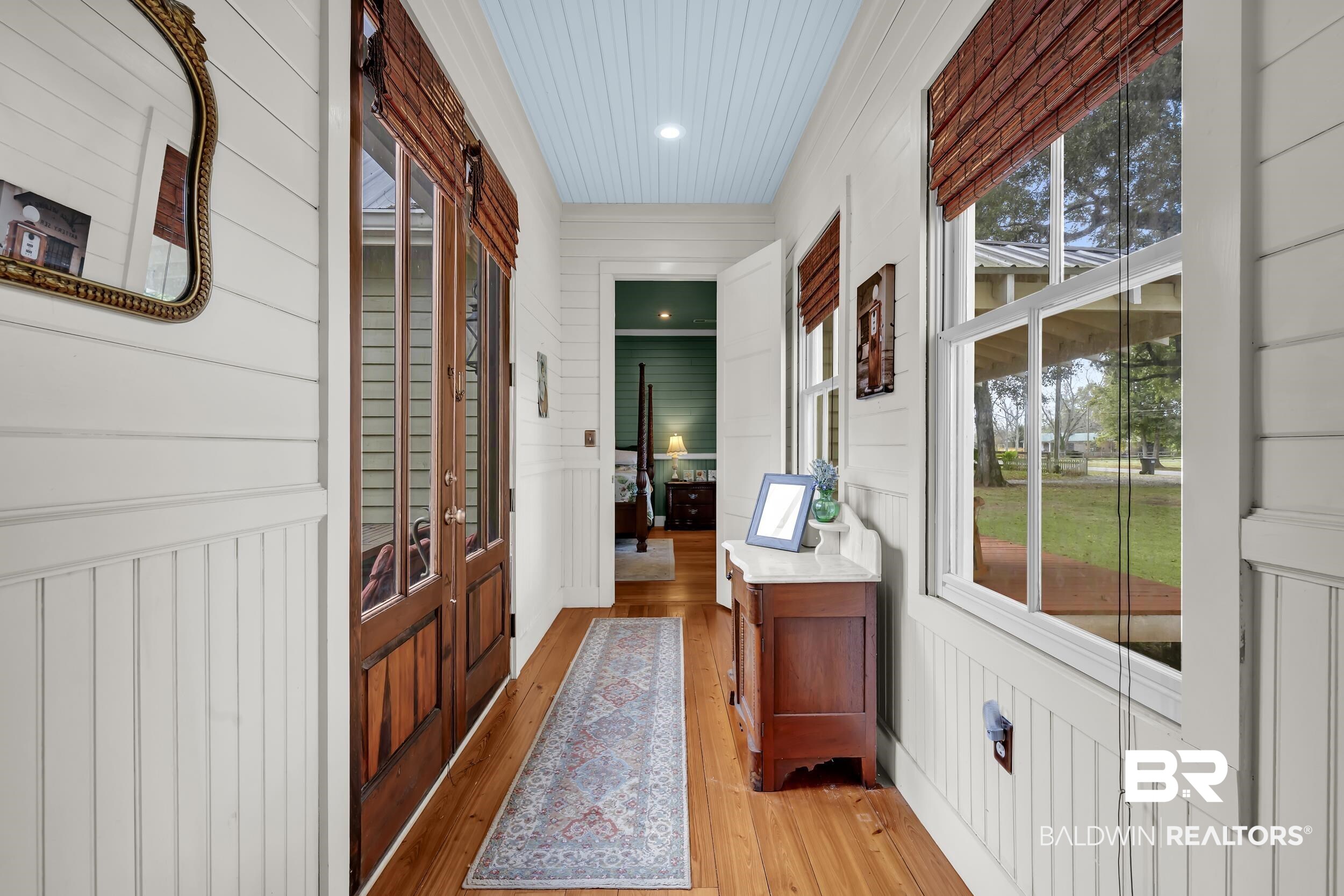 13232 Mary Ann Bch Road Fairhope, AL 36532 - Photo 25 of 79 Doorway to outside featuring wooden walls, wood-type flooring, and recessed lighting