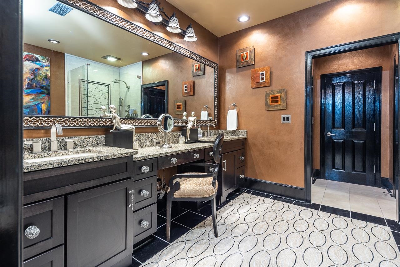 573 South Front Street Memphis, TN 38103 - Photo 29 of 40 a bathroom with a sink a large mirror and a shower