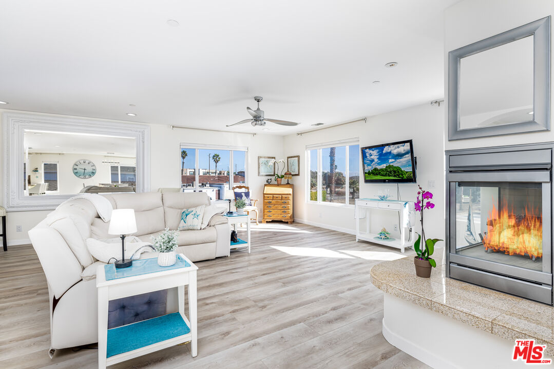 5101 Breakwater Way Oxnard, CA 93035 - Photo 12 of 39 a living room with furniture and a flat screen tv