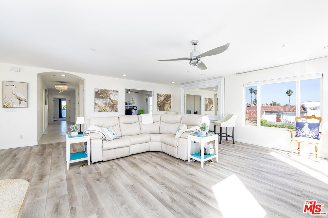 5101 Breakwater Way Oxnard, CA 93035 - Photo 13 of 39 a living room with furniture and a wooden floor