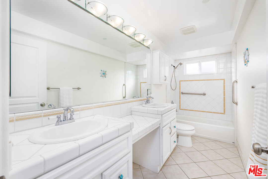 5101 Breakwater Way Oxnard, CA 93035 - Photo 26 of 39 a bathroom with a sink a toilet and shower