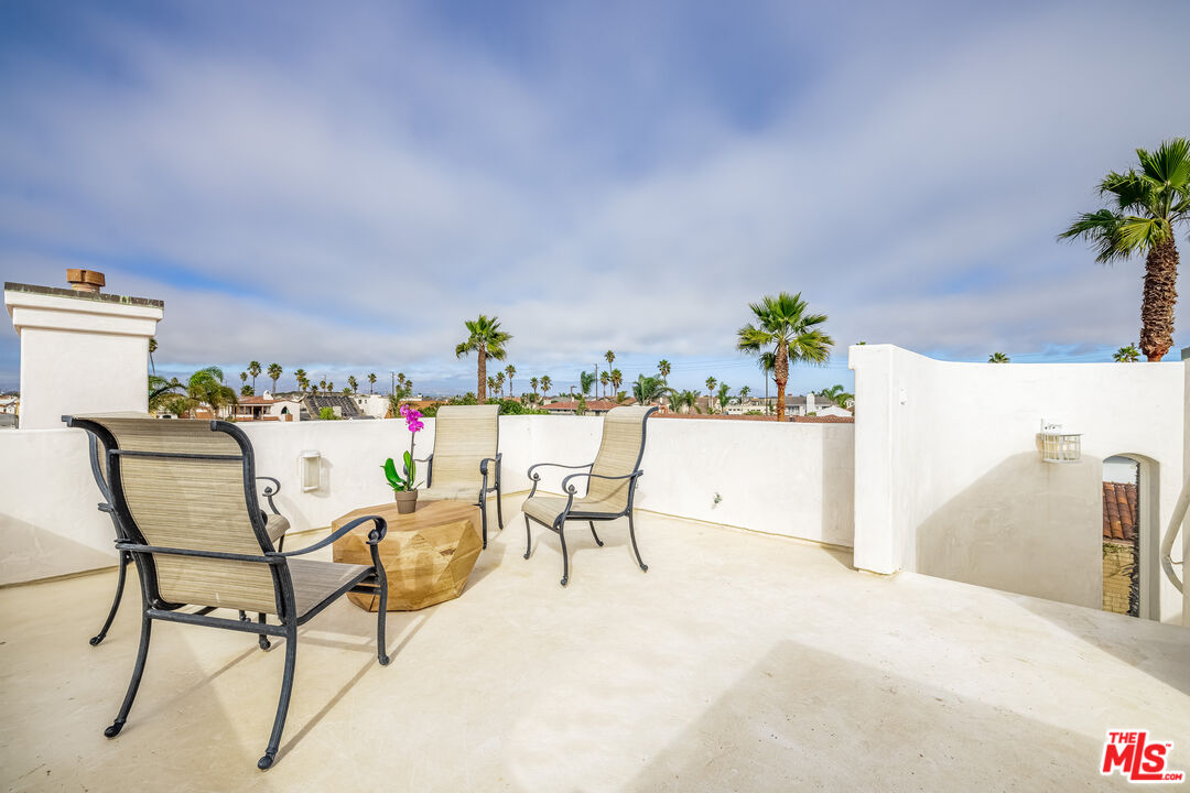 5101 Breakwater Way Oxnard, CA 93035 - Photo 32 of 39 a dining room with furniture and a potted plant