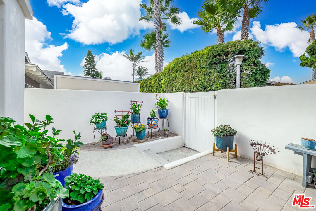 5101 Breakwater Way Oxnard, CA 93035 - Photo 35 of 39 a view of a chairs and table in a backyard