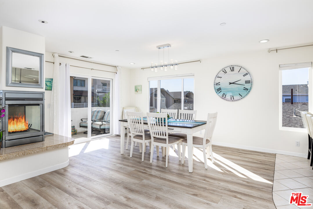 5101 Breakwater Way Oxnard, CA 93035 - Photo 10 of 39 a view of a dining room with furniture window and wooden floor