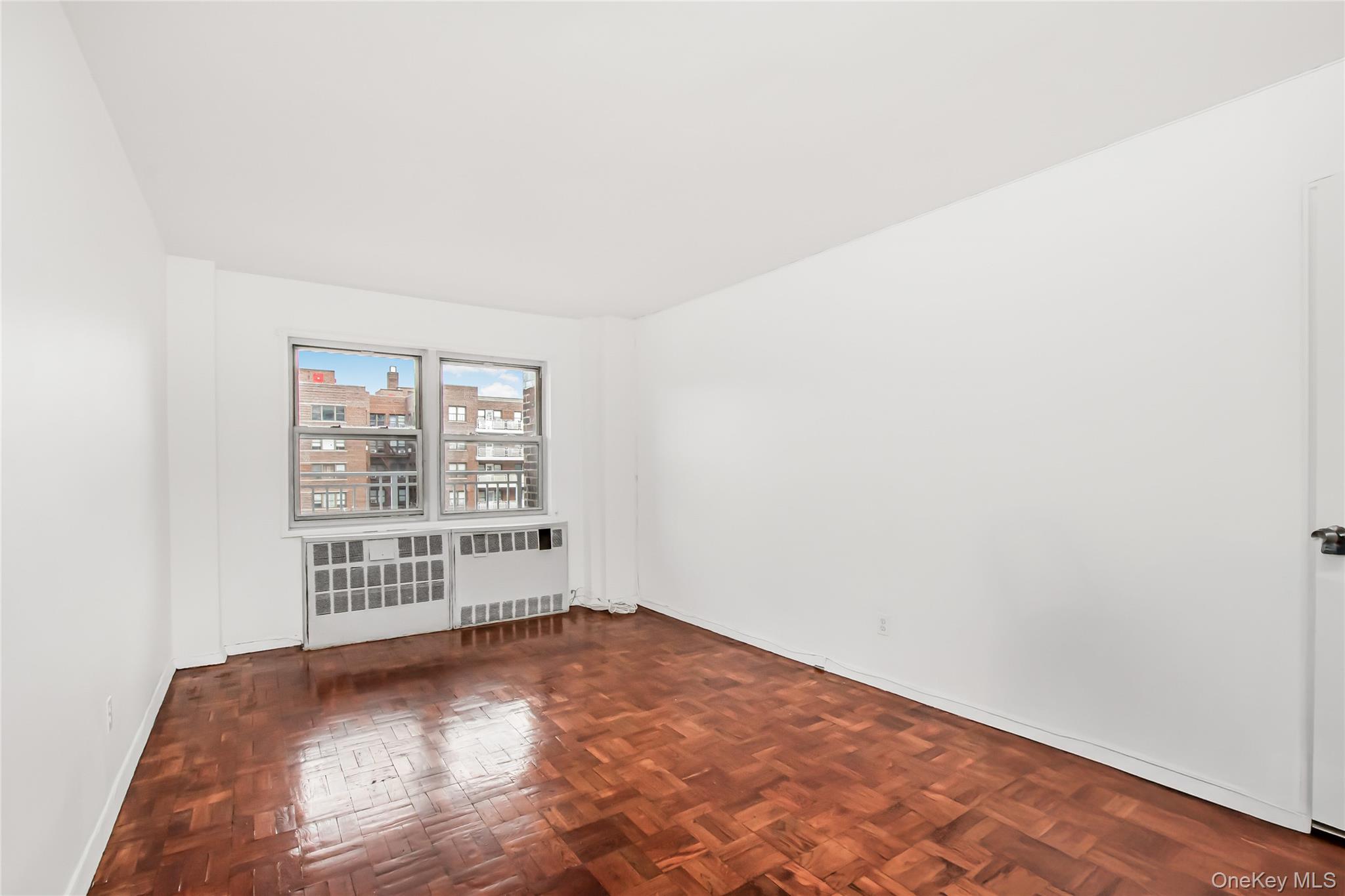 3131 Grand Concourse, Unit 5D Bronx, NY 10468 - Photo 11 of 22 an empty room with windows