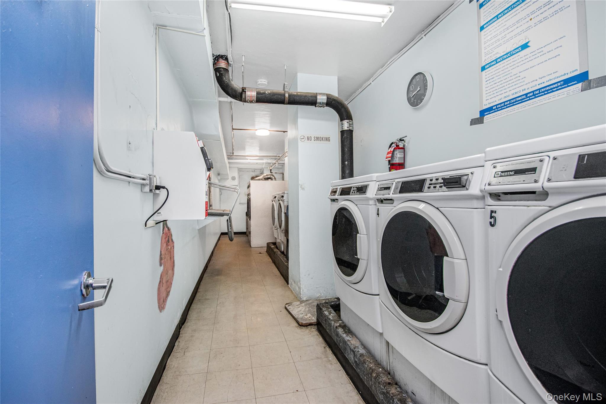 3131 Grand Concourse, Unit 5D Bronx, NY 10468 - Photo 20 of 22 a utility room with dryer and washer
