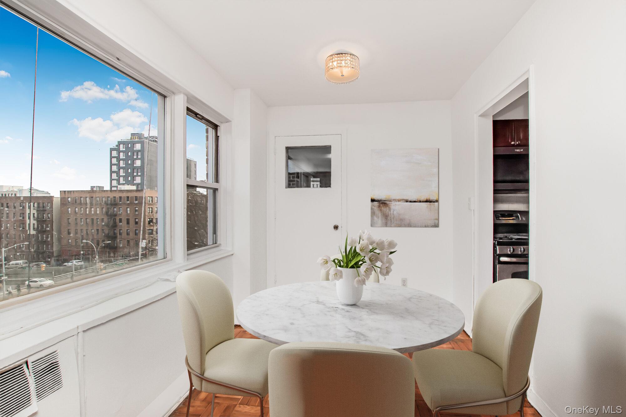 3131 Grand Concourse, Unit 5D Bronx, NY 10468 - Photo 8 of 22 a dining room with furniture and window