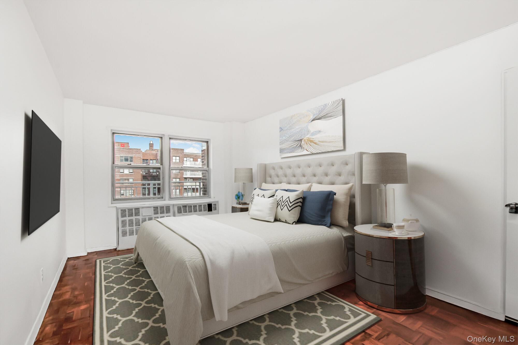 3131 Grand Concourse, Unit 5D Bronx, NY 10468 - Photo 10 of 22 a bedroom with a large bed and a flat tv screen on a dresser