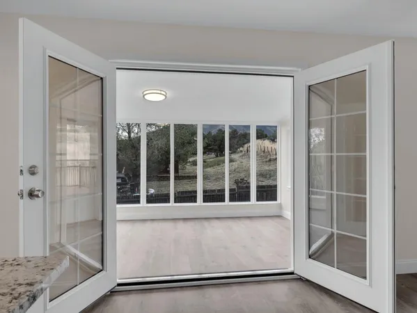 a view of an empty room with a window