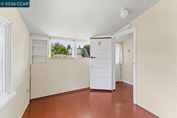 a kitchen with a refrigerator a stove a sink and a window