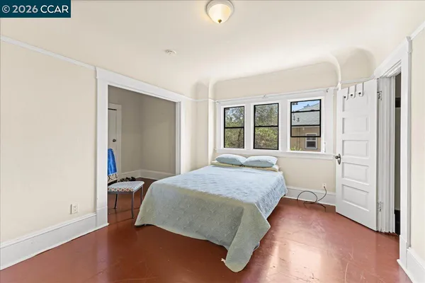 a view of a hallway with wooden floor and entryway