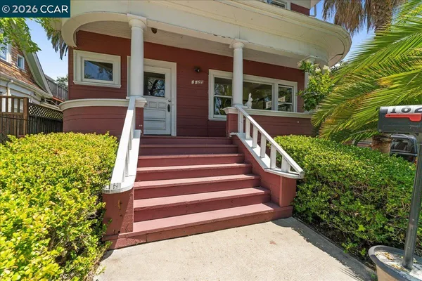 a kitchen with stainless steel appliances kitchen island granite countertop a sink stove and refrigerator