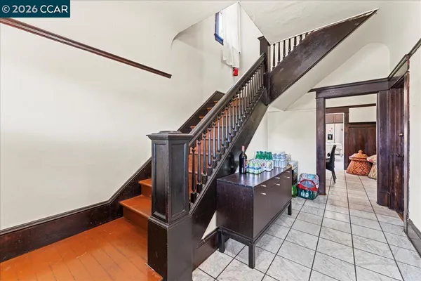a kitchen with a refrigerator and a sink