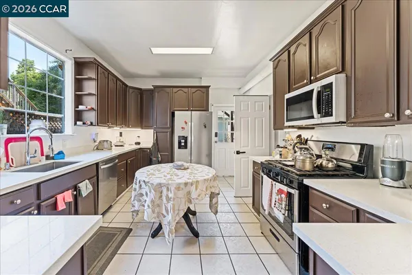 a bedroom with a bed and a large mirror in it