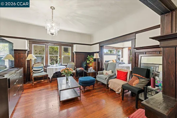 a bedroom with a bed and a potted plant