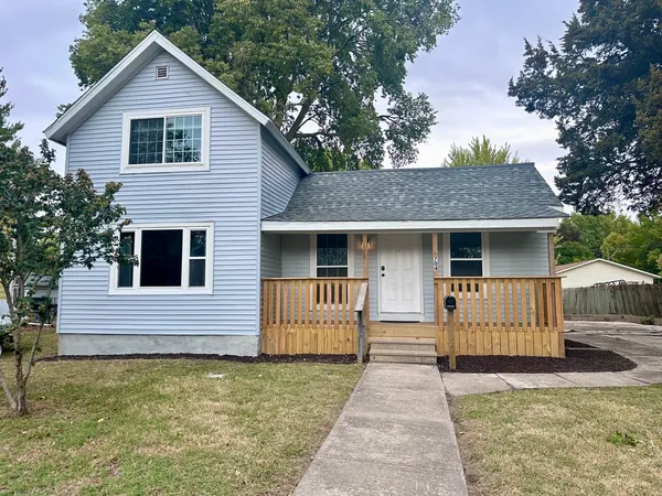 a front view of a house with garage