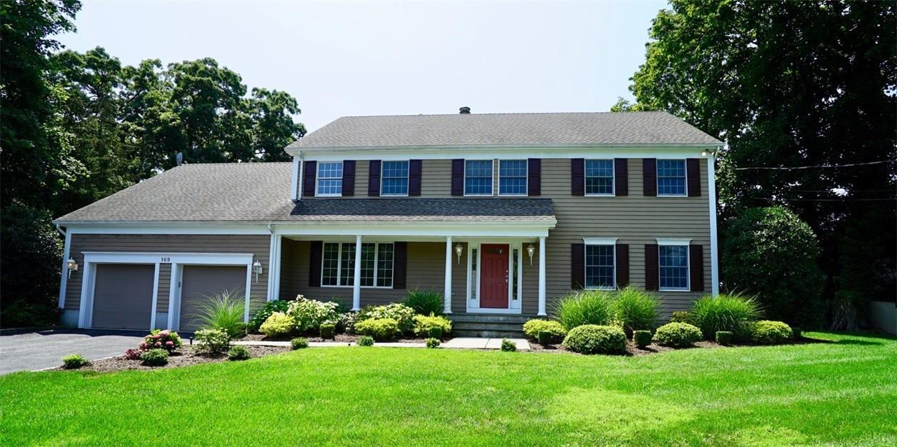 169 Locust Avenue Rye, NY 10580 - Photo 1 of 1 a front view of a house with a yard and porch