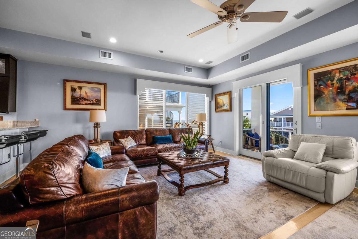 8 18th Street Tybee Island, GA 31328 - Photo 25 of 50 a living room with furniture and a large window