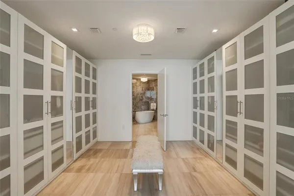 a bathroom with a granite countertop sink a toilet and a mirror