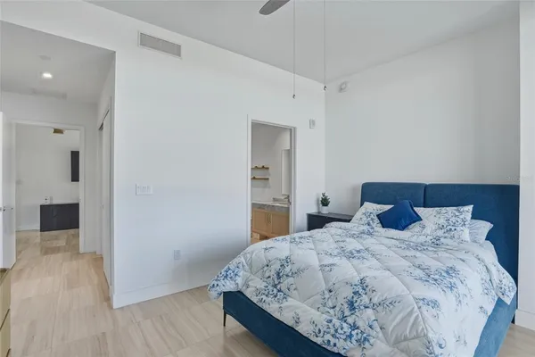 a en suite bathroom with a sink double vanity and a mirror