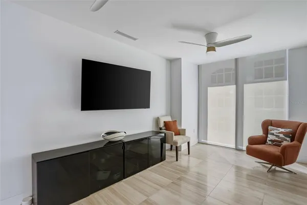 a view of a livingroom with furniture and a window