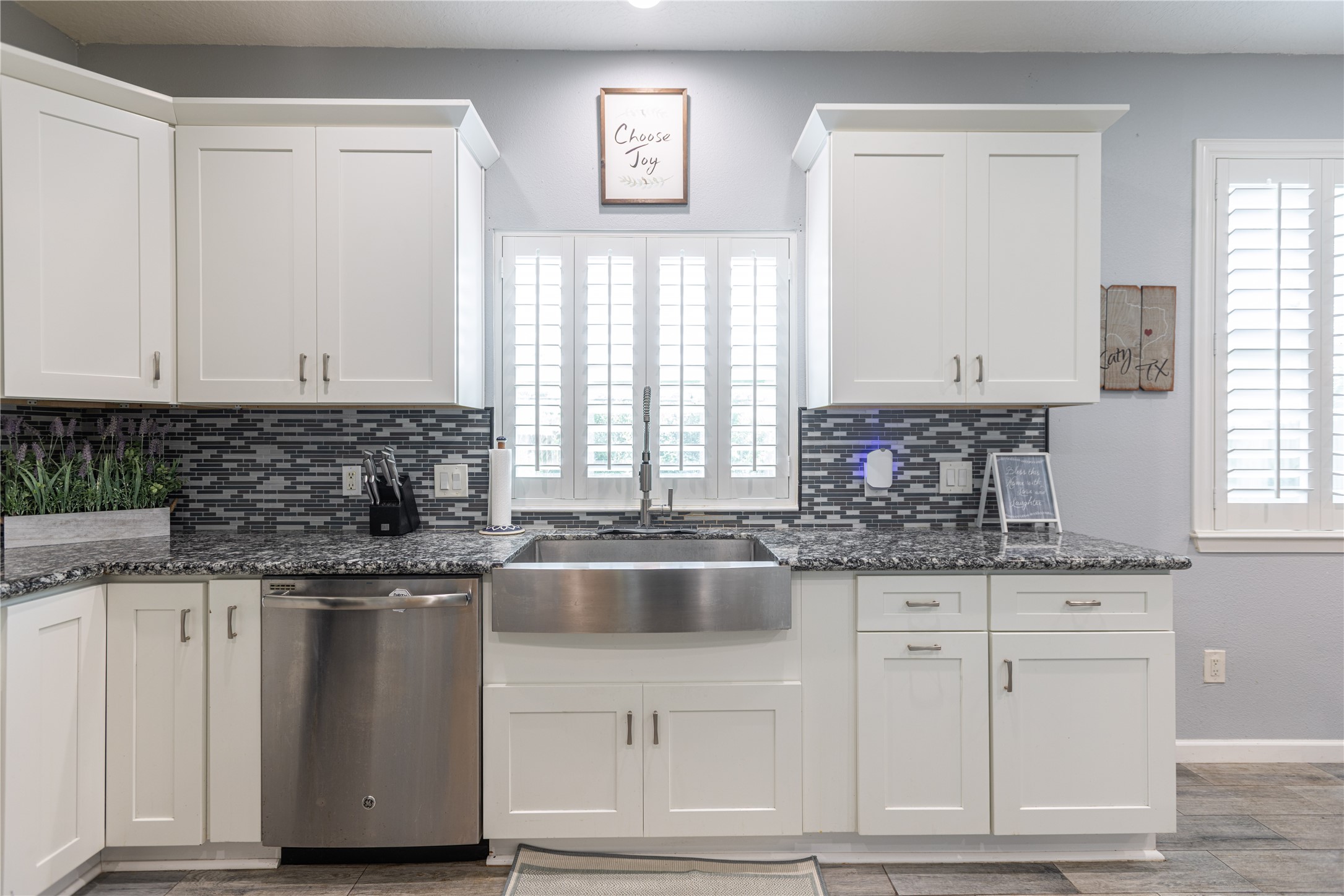5922 Walkabout Way Katy, TX 77450 - Photo 15 of 38 A stunning farmhouse sink serves as a focal point in the kitchen, blending classic style with modern functionality