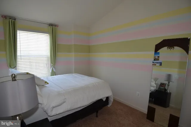 a bedroom with a bed and a table