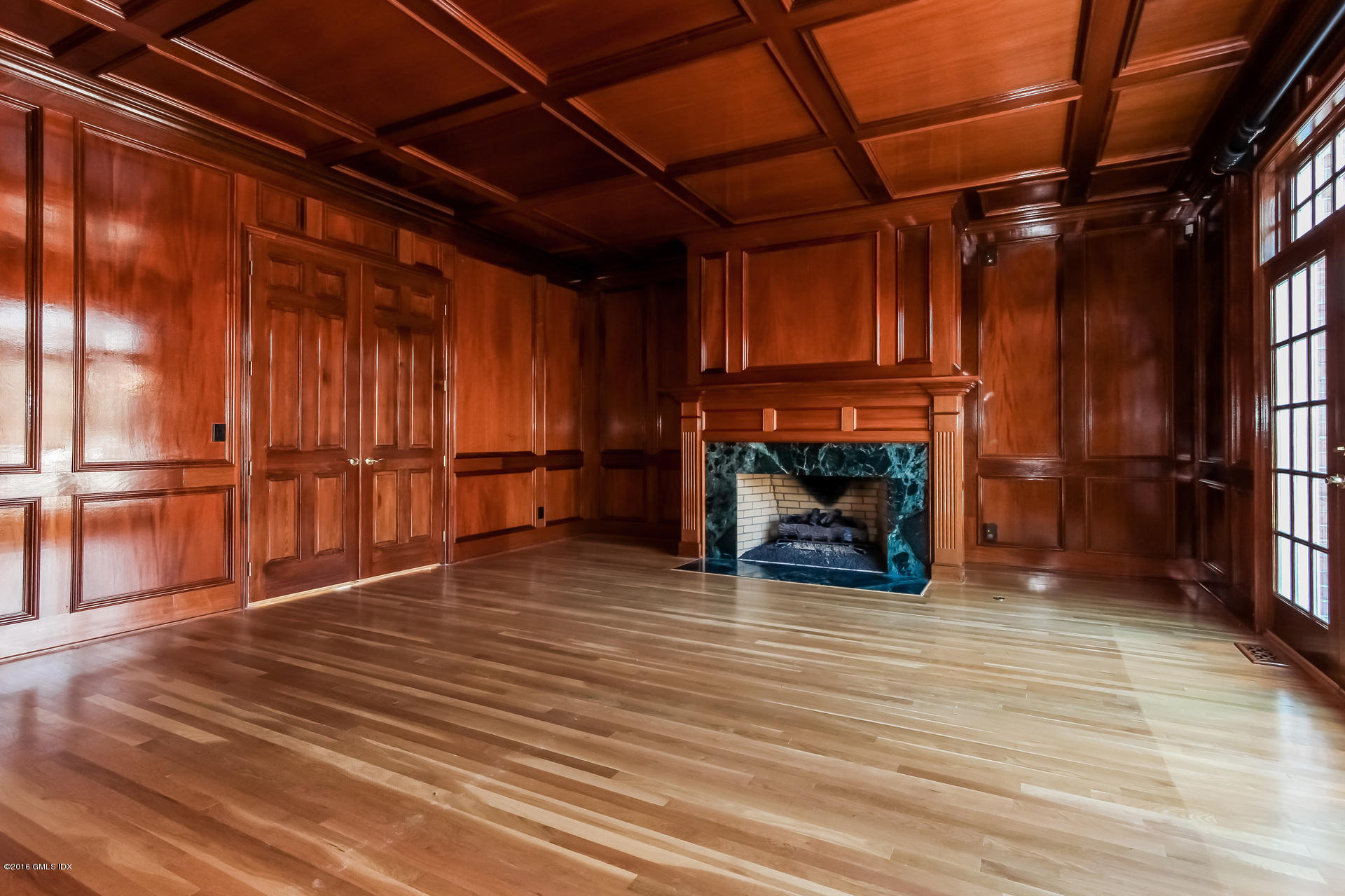 591 Round Hill Road Greenwich, CT 06831 - Photo 18 of 51 a view of a room with wooden floor and a fireplace