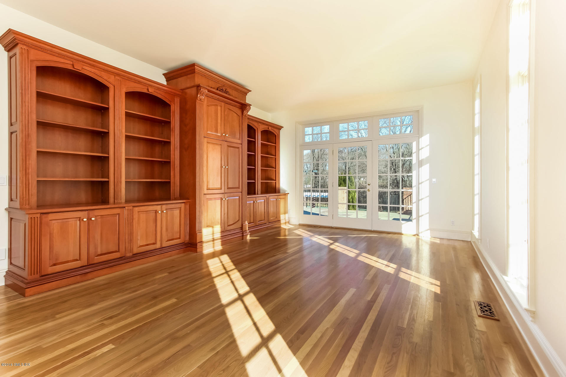 591 Round Hill Road Greenwich, CT 06831 - Photo 20 of 51 a view of an empty room with wooden floor and a window